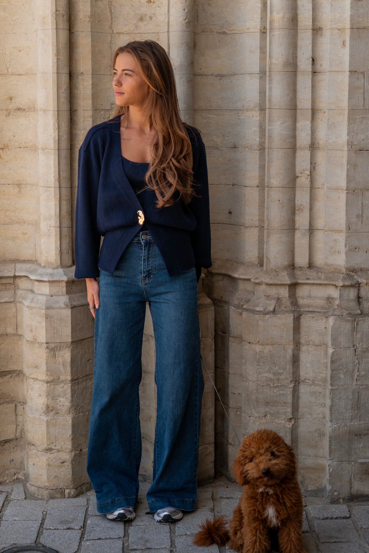 Navy vest met goude knoop